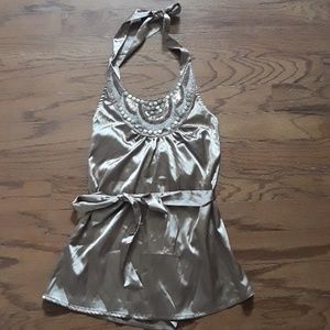Neverworn silk halter top ties around the waist.